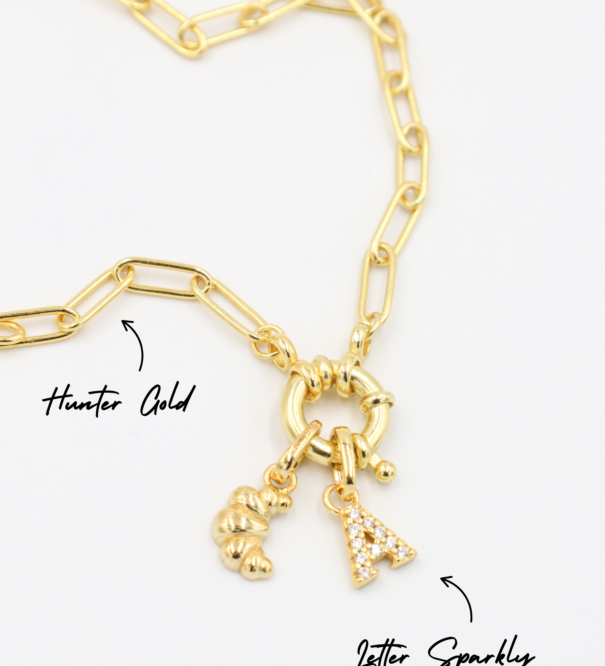 Gold-plated 925 sterling silver Croissant pendant styled with a Hunter Gold necklace and a Letter Sparkly pendant.