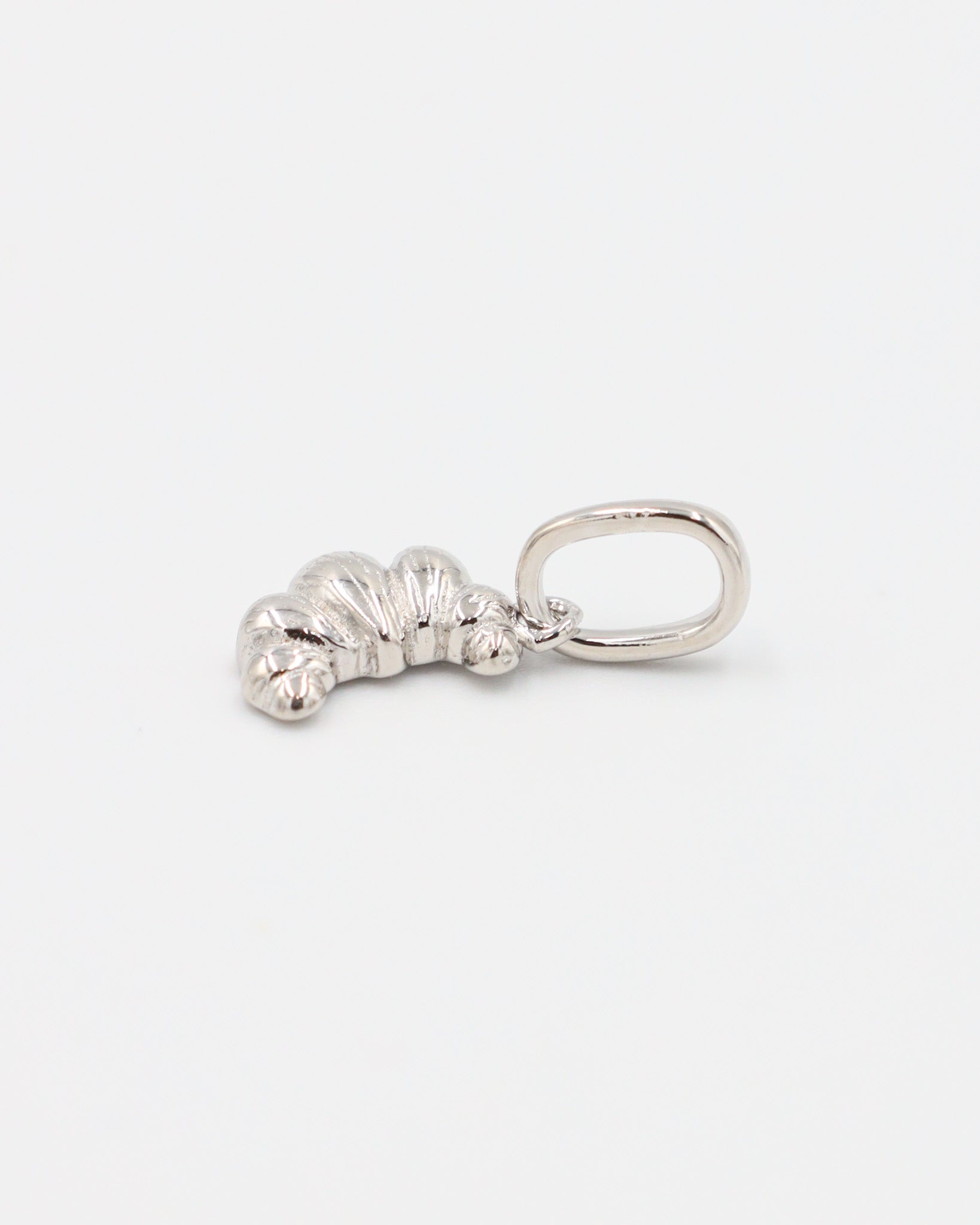 Croissant Silver pendant made from rhodium-plated 925 sterling silver, shown from a side angle.