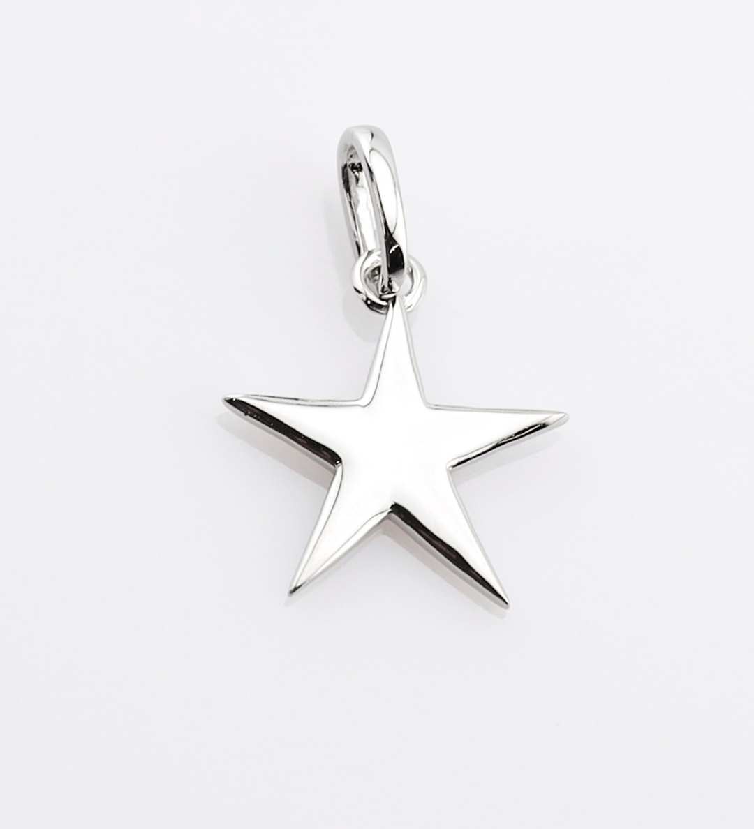 Silver star-shaped pendant on a white background