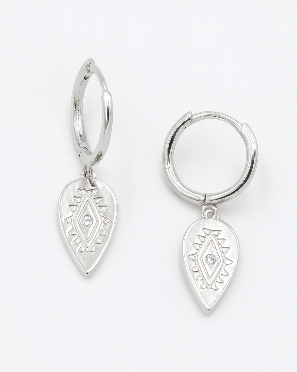 Pair of silver hoop earrings with teardrop-shaped dangling charms on a white background