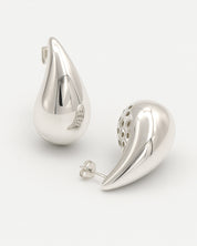 Pair of silver teardrop-shaped earrings on a white background