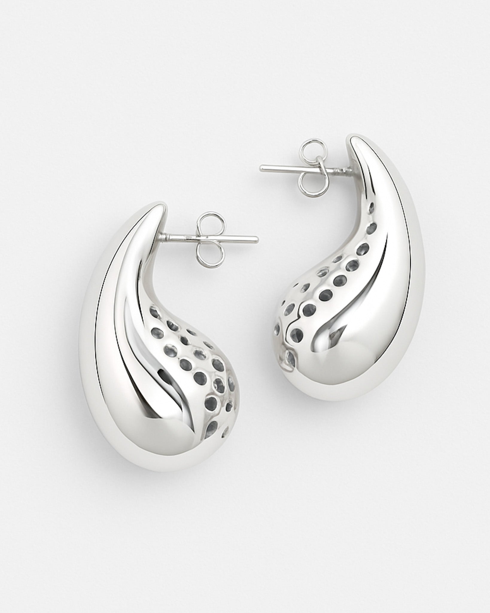 Silver earrings with a unique design on a white background