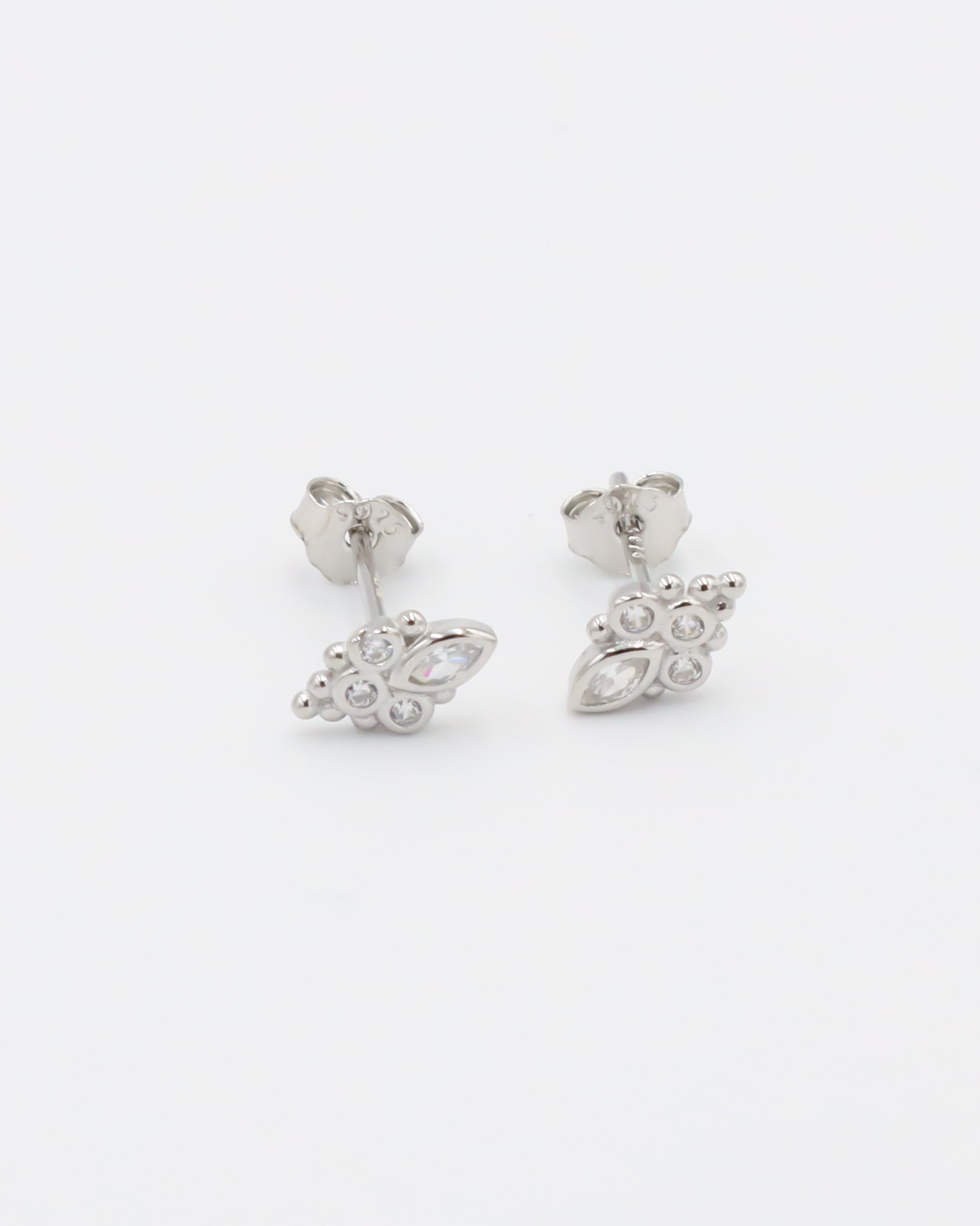 A single silver stud earring with a butterfly clasp and multiple gemstone accents.