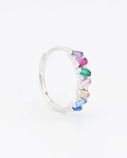 Silver hoop earring with multicolored gemstones on a white background