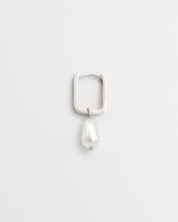 A single silver hoop earring with pearl accents on a white background
