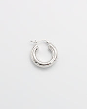 A single silver hoop earring with a latch back closure mechanism, displayed on a white background.