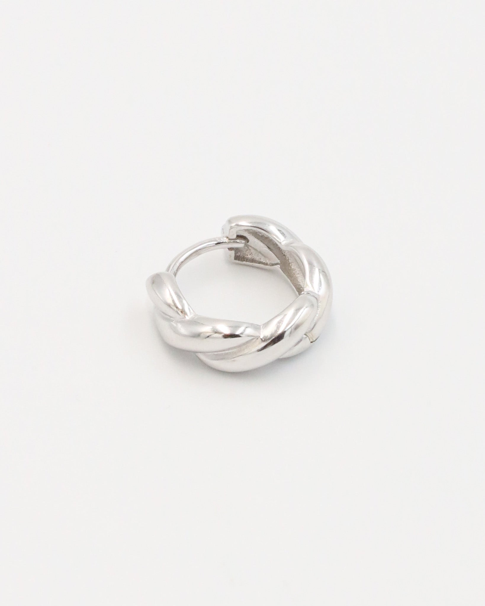 A pair of silver hoop earrings with a hinged clasp closure, displayed against a white background.