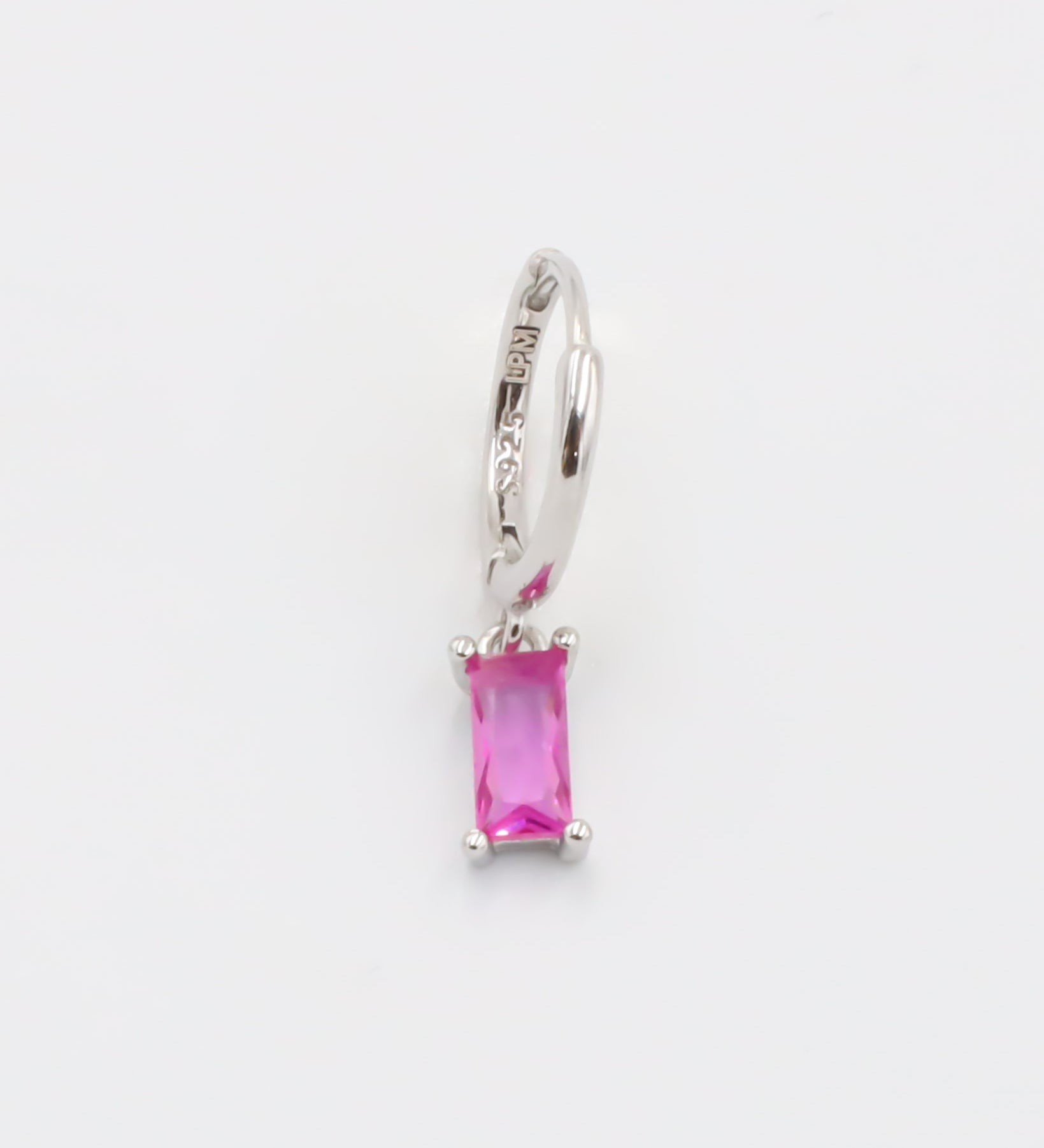 A pink and silver colored hoop earring with a hinged clasp.