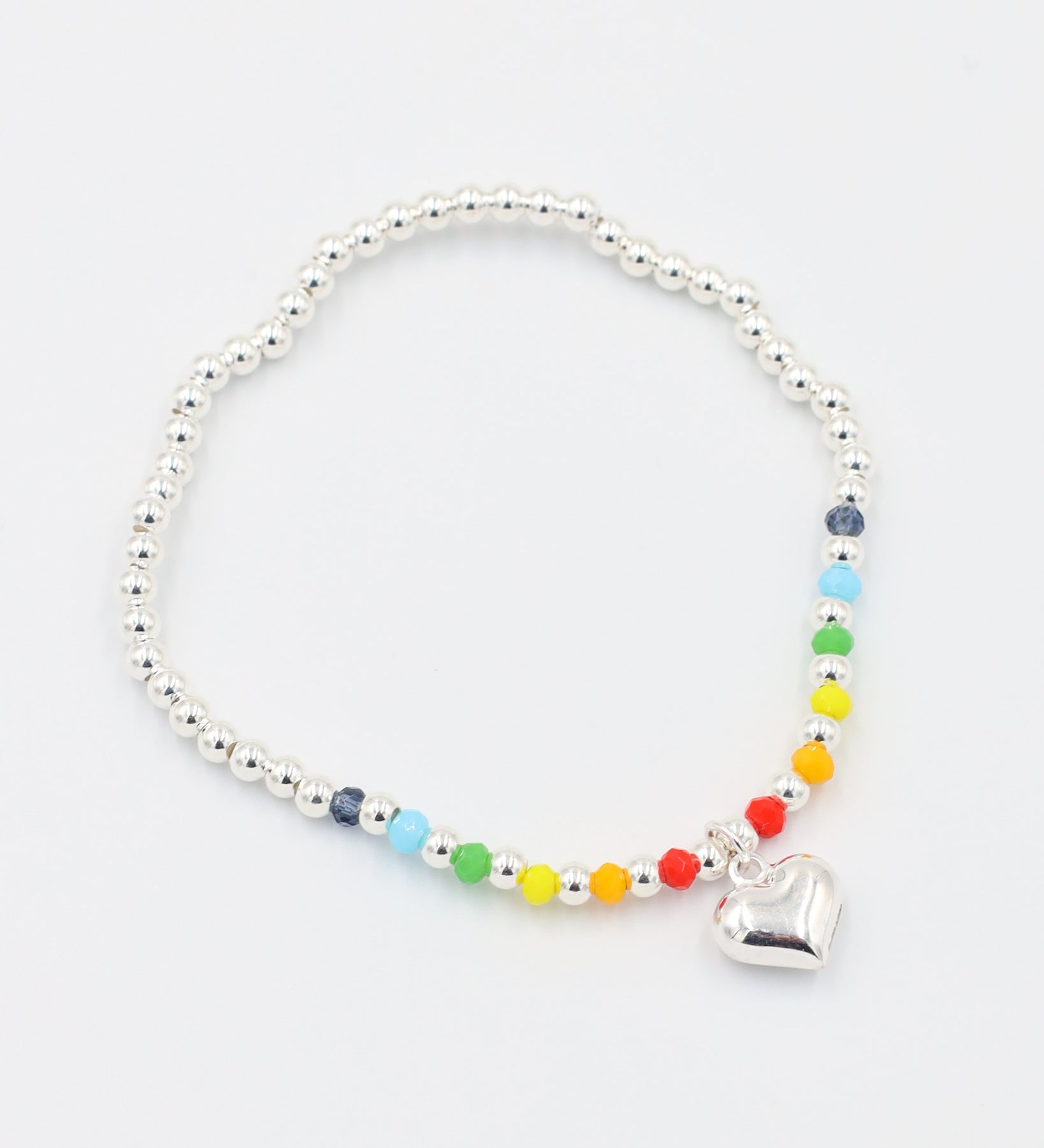 Front view of the adjustable Gayle Silver bracelet made of 925 sterling silver, featuring colorful beads and a heart charm.