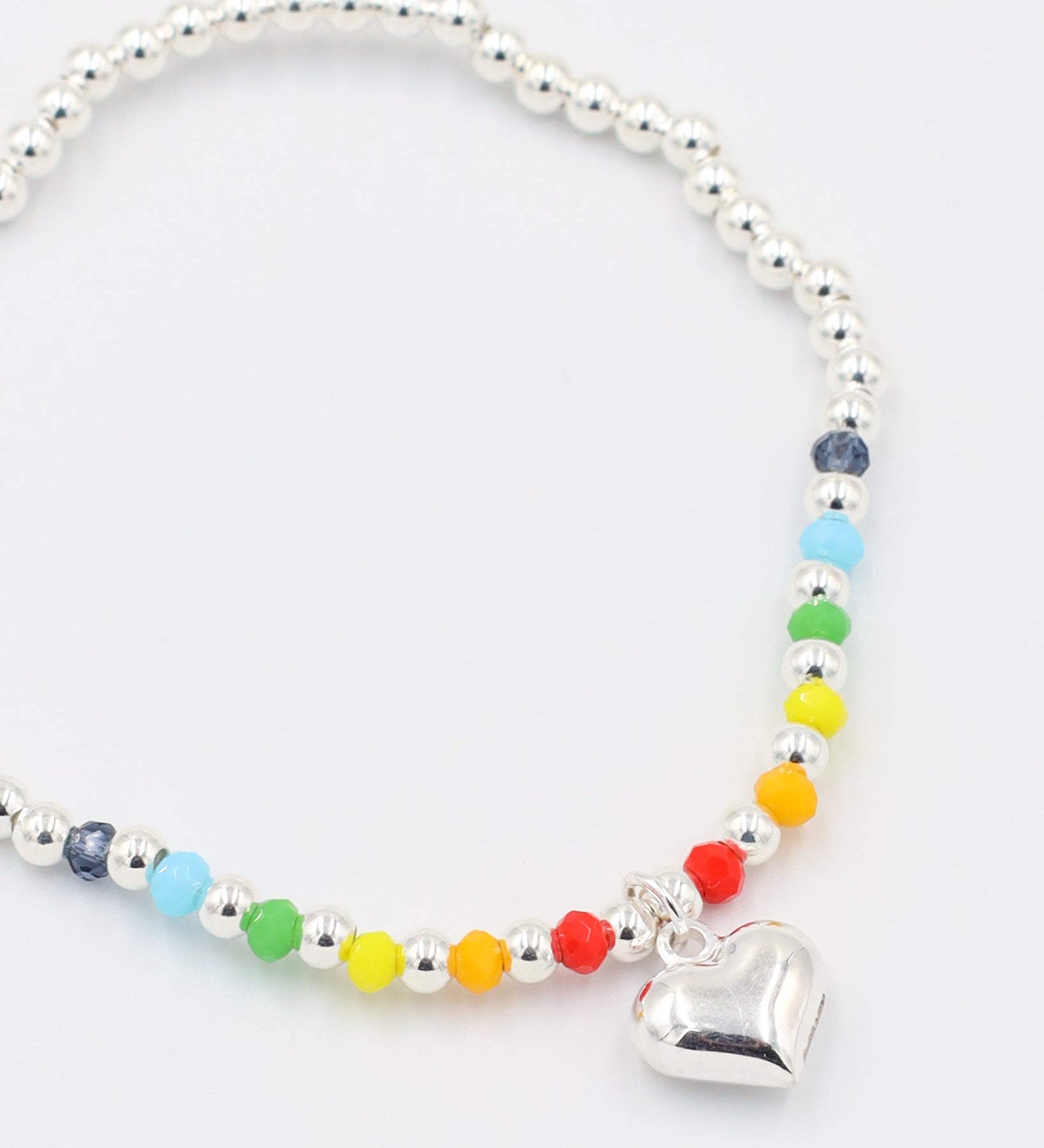 Detailed view of the Gayle Silver bracelet made of 925 sterling silver, featuring colorful beads and a heart charm.