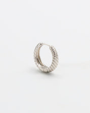 A single silver hoop earring with a hinged clasp, displayed against a white background.