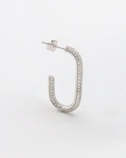 A single silver-colored hoop earring with a butterfly clasp closure, displayed against a white background.