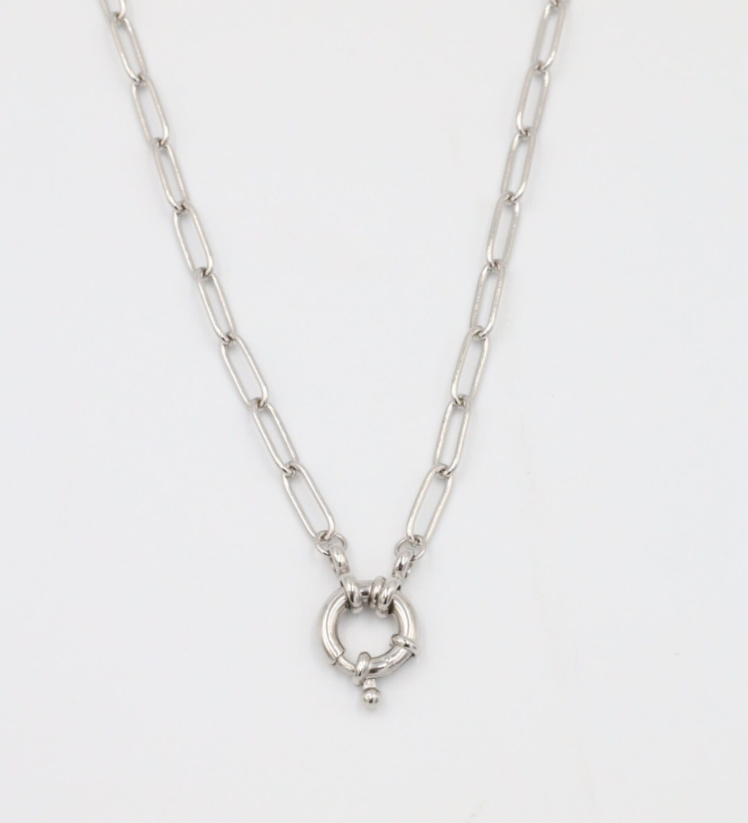 A close-up of the Hunter Necklace in 925 sterling silver featuring an elegant circular clasp on a link chain.