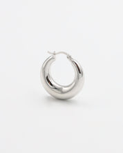 A pair of silver hoop earrings with a latch back closure, displayed against a white background.