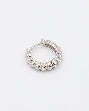 A single silver hoop earring with a hinged clasp, displayed against a white background.
