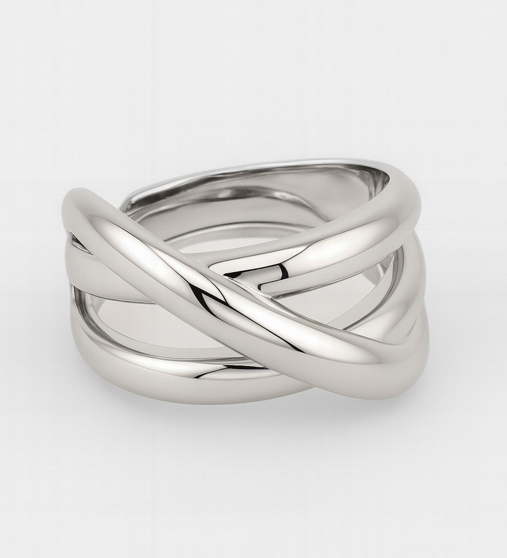 Silver ring with a braided design on a white background