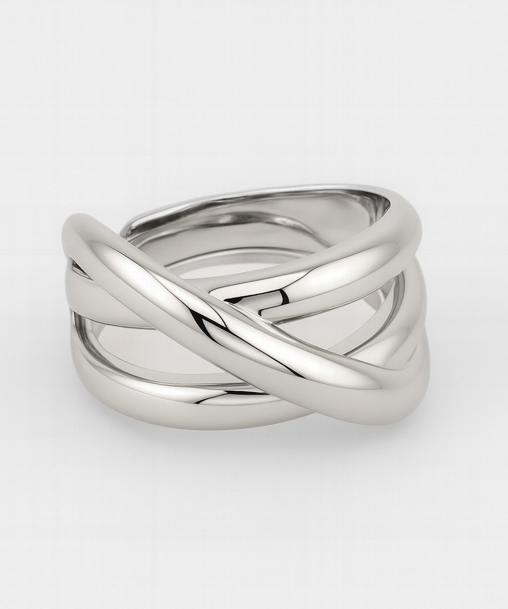 Silver ring with a braided design on a white background