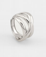 Silver ring with a wavy design on a white background