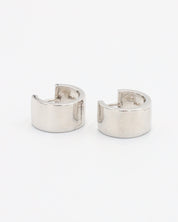 A single silver hoop earring with a hinged clasp, displayed against a white background.