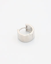 A single silver hoop earring with a hinged clasp, displayed against a white background.
