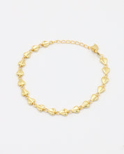 A gold-colored bracelet with a chain link design on a white background