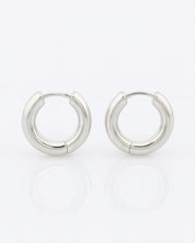 Pair of silver hoop earrings on a white background