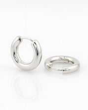 Pair of silver hoop earrings on a white background