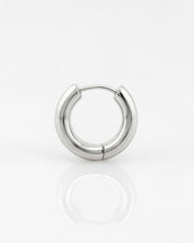 Silver hoop earring on a white background