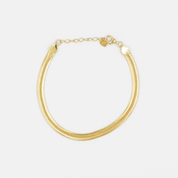 A gold-colored bracelet with a chain link closure on a white background.