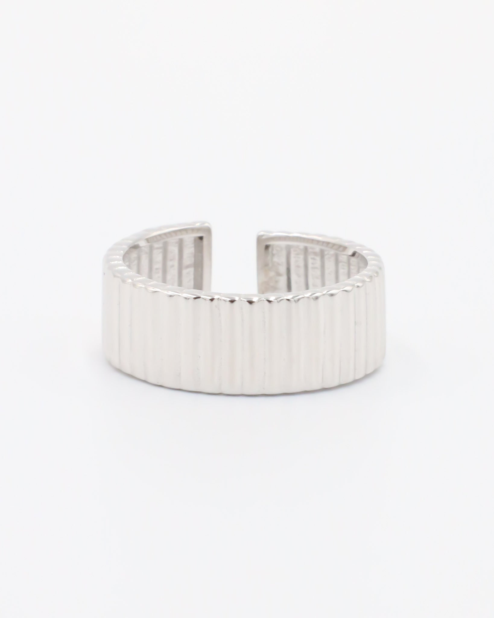 An adjustable sterling silver ring with a textured band, displayed on a white background.