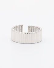 An adjustable sterling silver ring with a textured band, displayed on a white background.