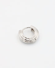 A pair of silver hoop earrings with a hinged clasp closure.