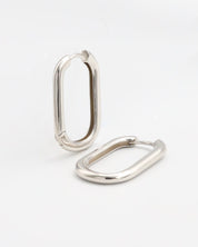 Two silver-colored metal belt buckles with a simple, classic design on a white background.