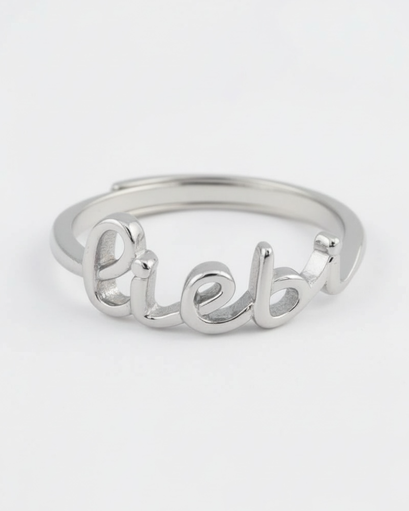 Silver ring with 'Lieb' engraving on a white background