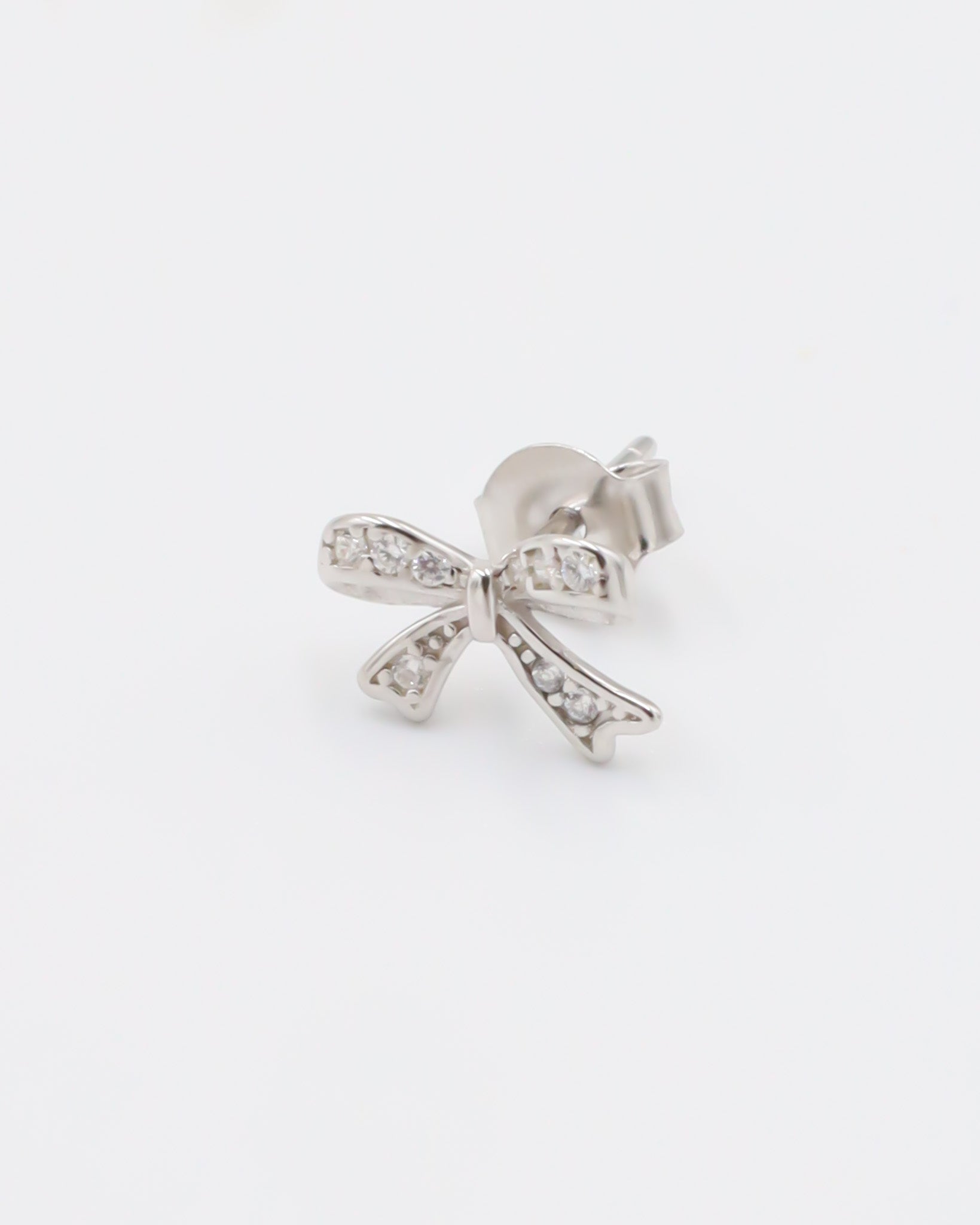 A pair of silver hoop earrings with butterfly closures and small clear embellishments, displayed against a white background.