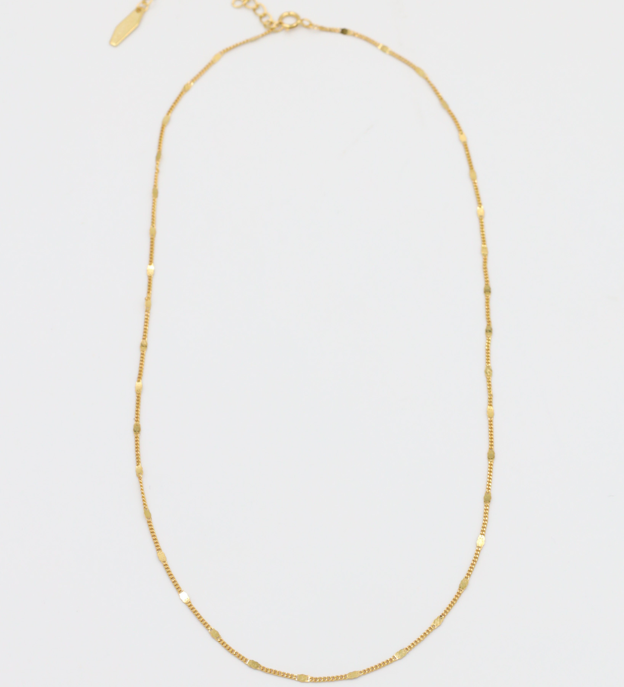 Loretta Necklace in gold-plated sterling silver shown with chain laid out.