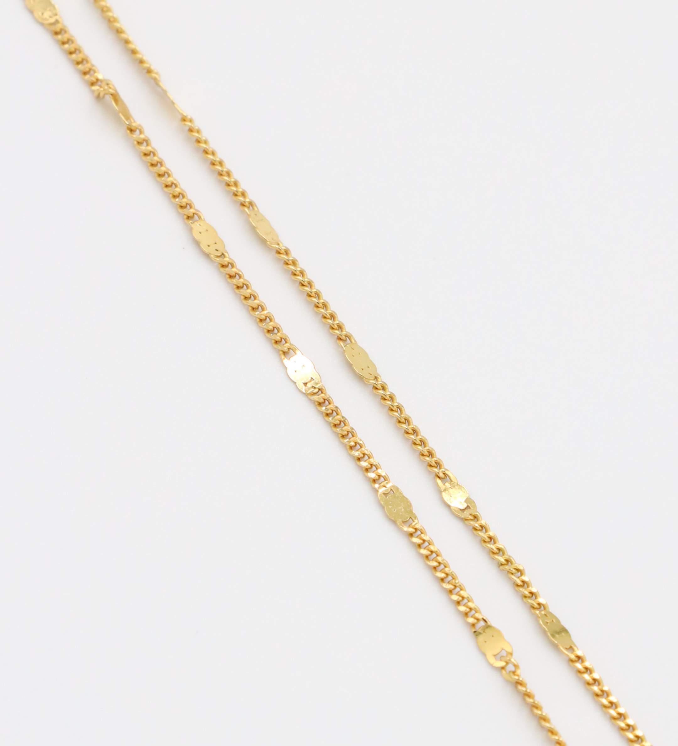 Close-up view of the detailed links on the gold-plated Loretta Necklace.