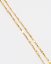 Close-up view of the detailed links on the gold-plated Loretta Necklace.