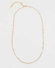 Loretta Necklace in gold-plated sterling silver shown with chain laid out.