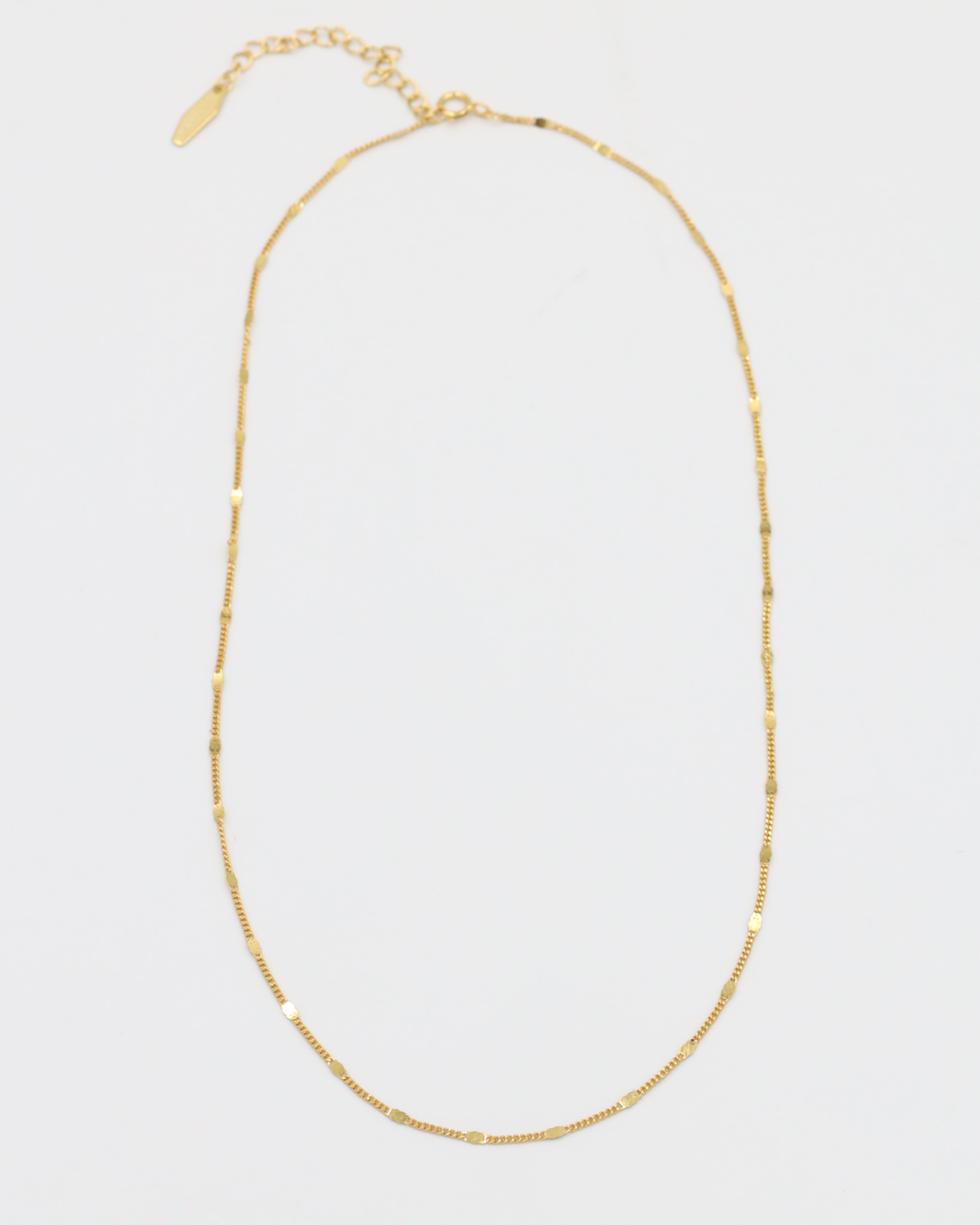 Loretta Necklace in gold-plated sterling silver shown with chain laid out.