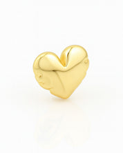 Gold heart-shaped charm on a white background
