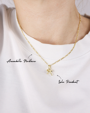 Gold necklace with pendant on a white background