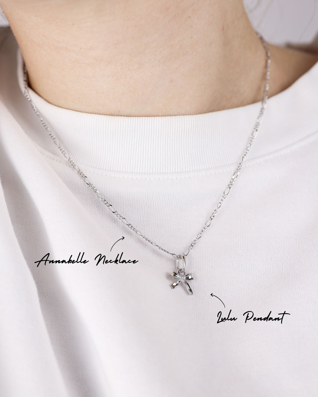 Silver necklace with a pendant on a white background