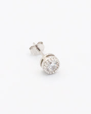 A single silver stud earring with a butterfly clasp and small clear stones arranged in a circular pattern around the central stone.