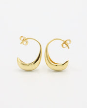 A pair of small gold-colored hoop earrings with a modern design.