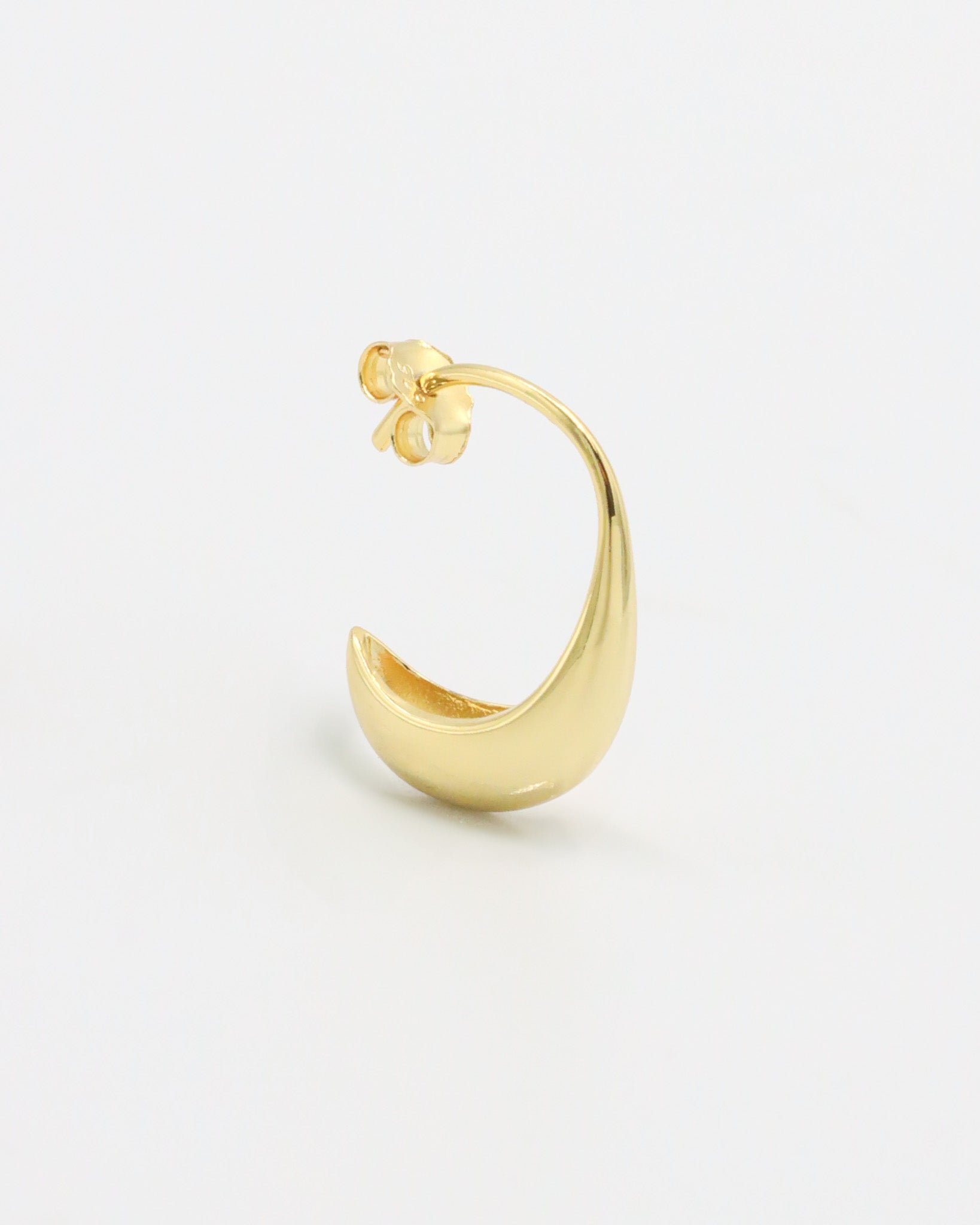 A pair of small gold-colored hoop earrings with a modern design.