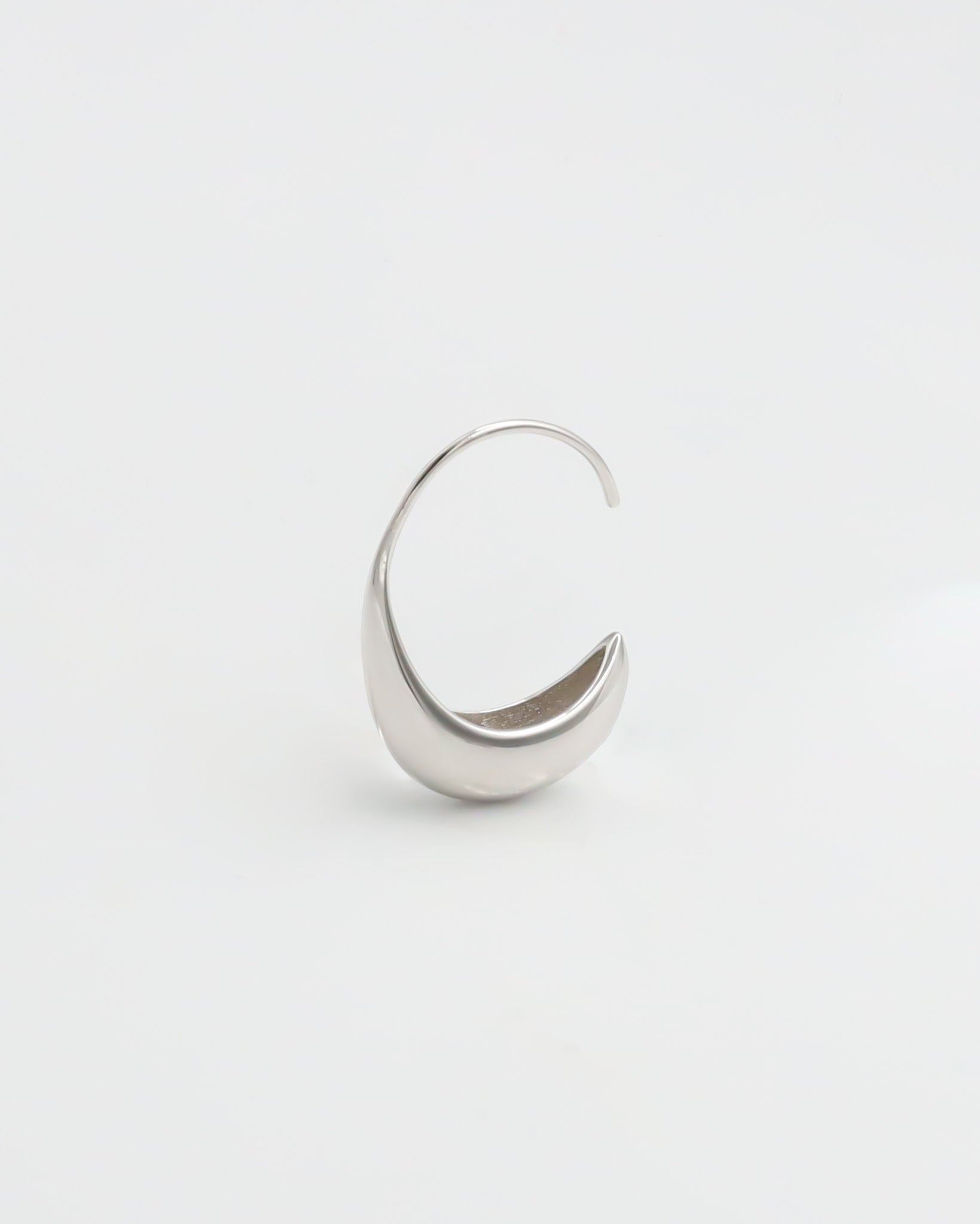 A pair of silver-colored hoop earrings on a white background