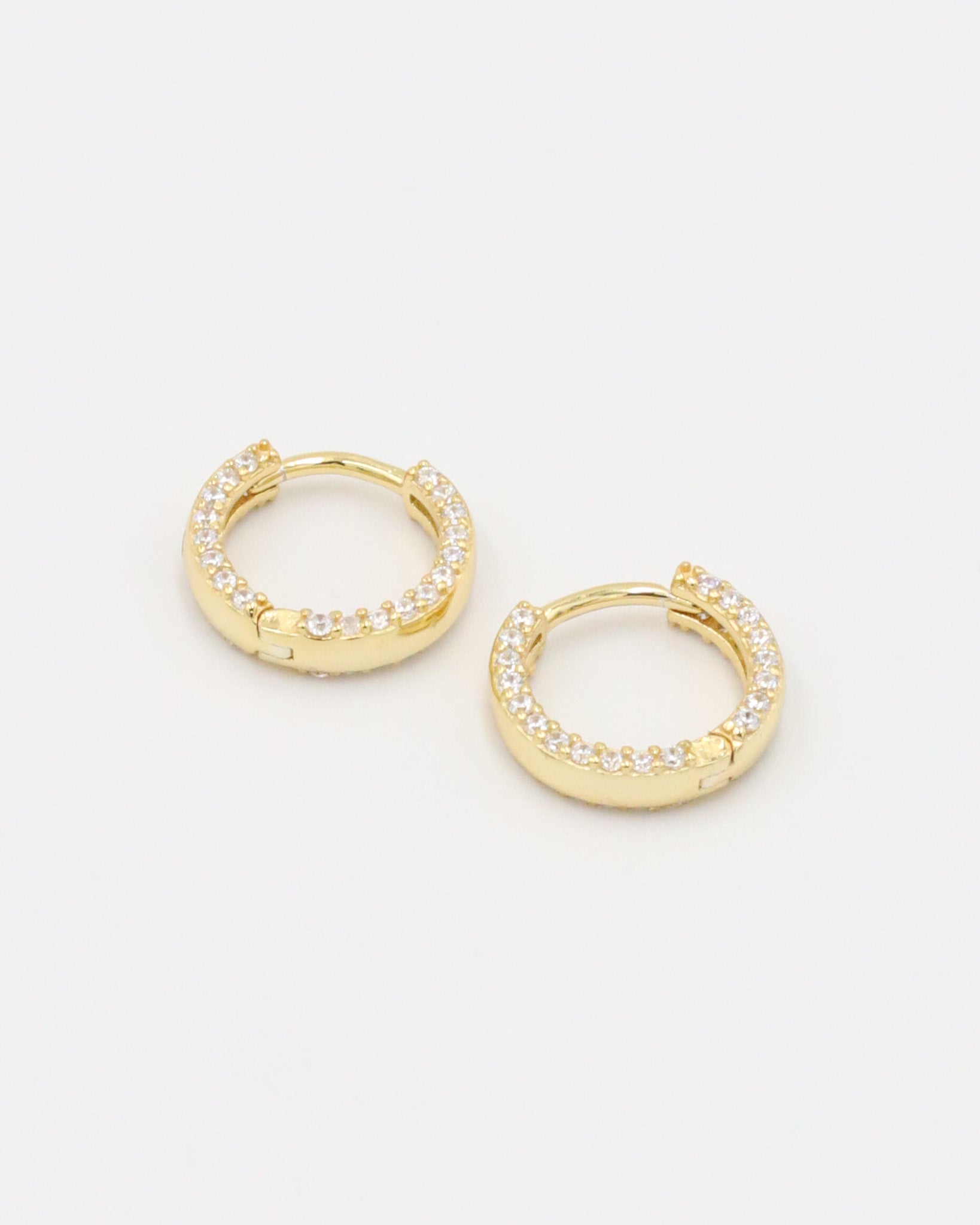 Pair of gold-plated sterling silver Mara hoop earrings, beautifully adorned with a full pavé of sparkling zirconia stones.