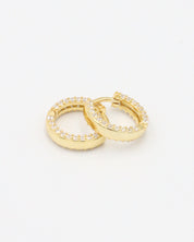 Close-up of Mara gold-plated sterling silver hoops, showcasing the zirconia-studded design for a luxurious finish.