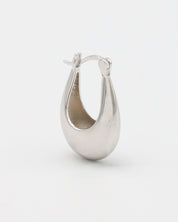 This image displays a pair of elegant silver earrings, referred to as the Marigold Silver piece. The earrings feature a sleek, polished design with a smooth, curved structure that reflects light beautifully.